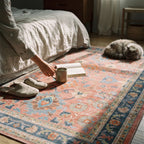 Calabria Coral Multicolor Rug in a sunlit bedroom