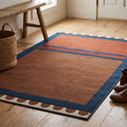 Nina Indigo and Rust Rug in an entryway