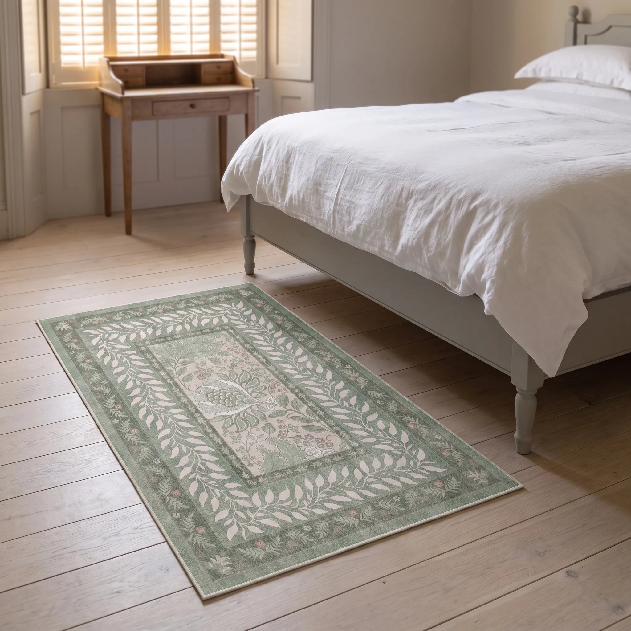 Provence Sage Rug beside a bed