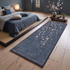 Sakura Indigo Cherry Blossom Rug in a bedroom