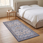 Strawberry Thief Indigo and Ivory Rug in a bedroom
